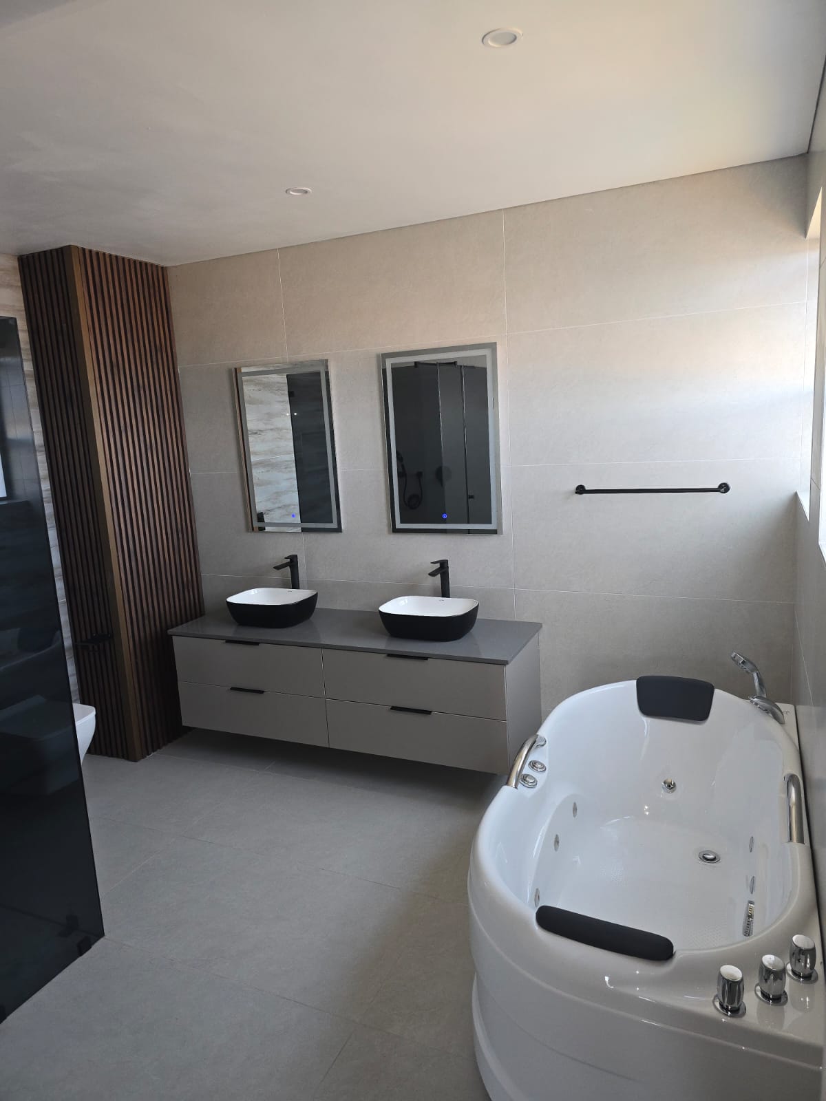 Luxury bathroom with jacuzzi and double vanity